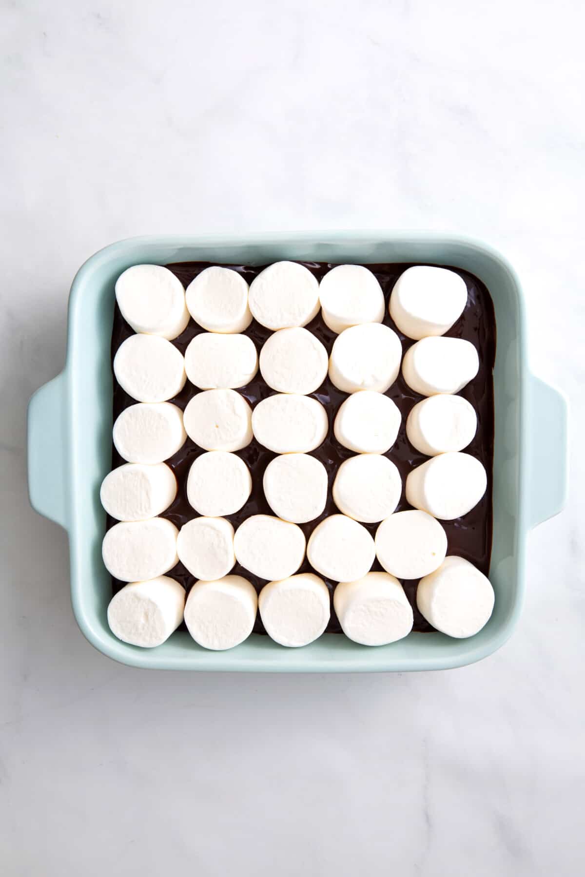 step 3 to make s'mores dip, cover the top with marshmallows.