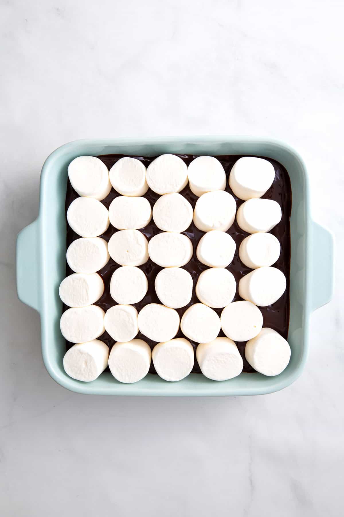 step 3 to make s'mores dip, cover the top with marshmallows