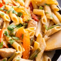 A skillet full of spicy chicken chipotle pasta.