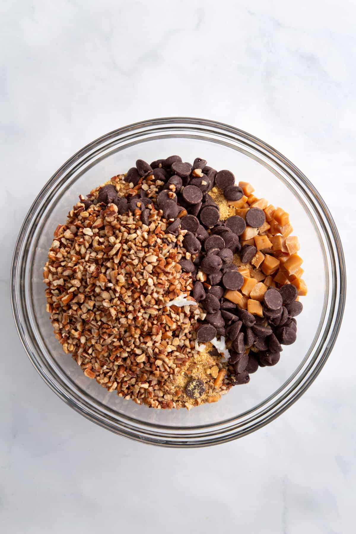 step 1 to make texas trash pie, combine dry ingredients in a large clear bowl.