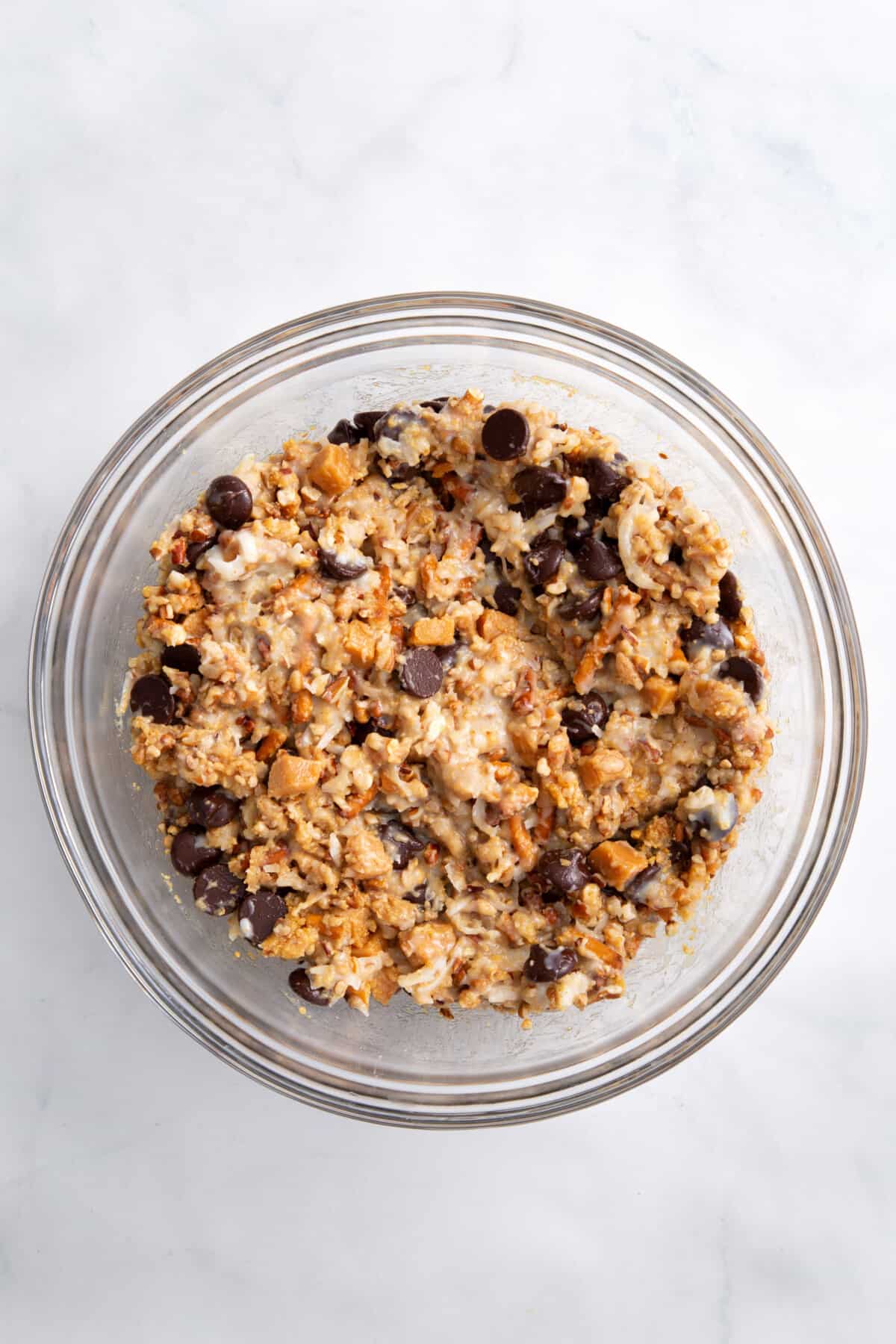 step 2 to make texas trash pie, combine dry and wet ingredients in a large clear bowl.