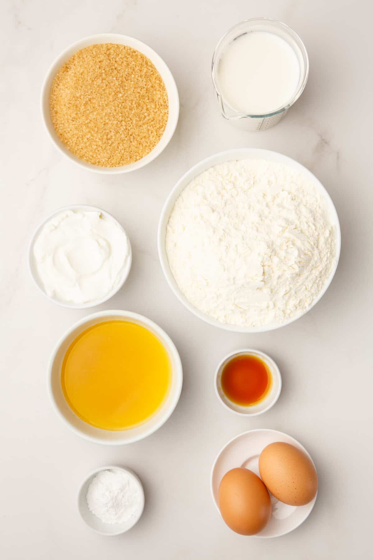 Ingredients for cinnamon roll cake with frosting. 
