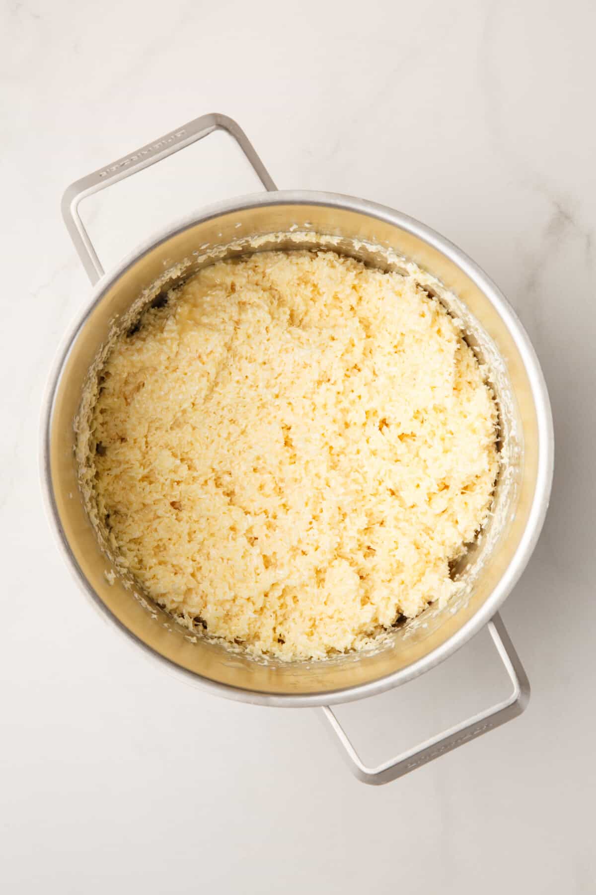 coconut topping in a stainless steel saucepan.