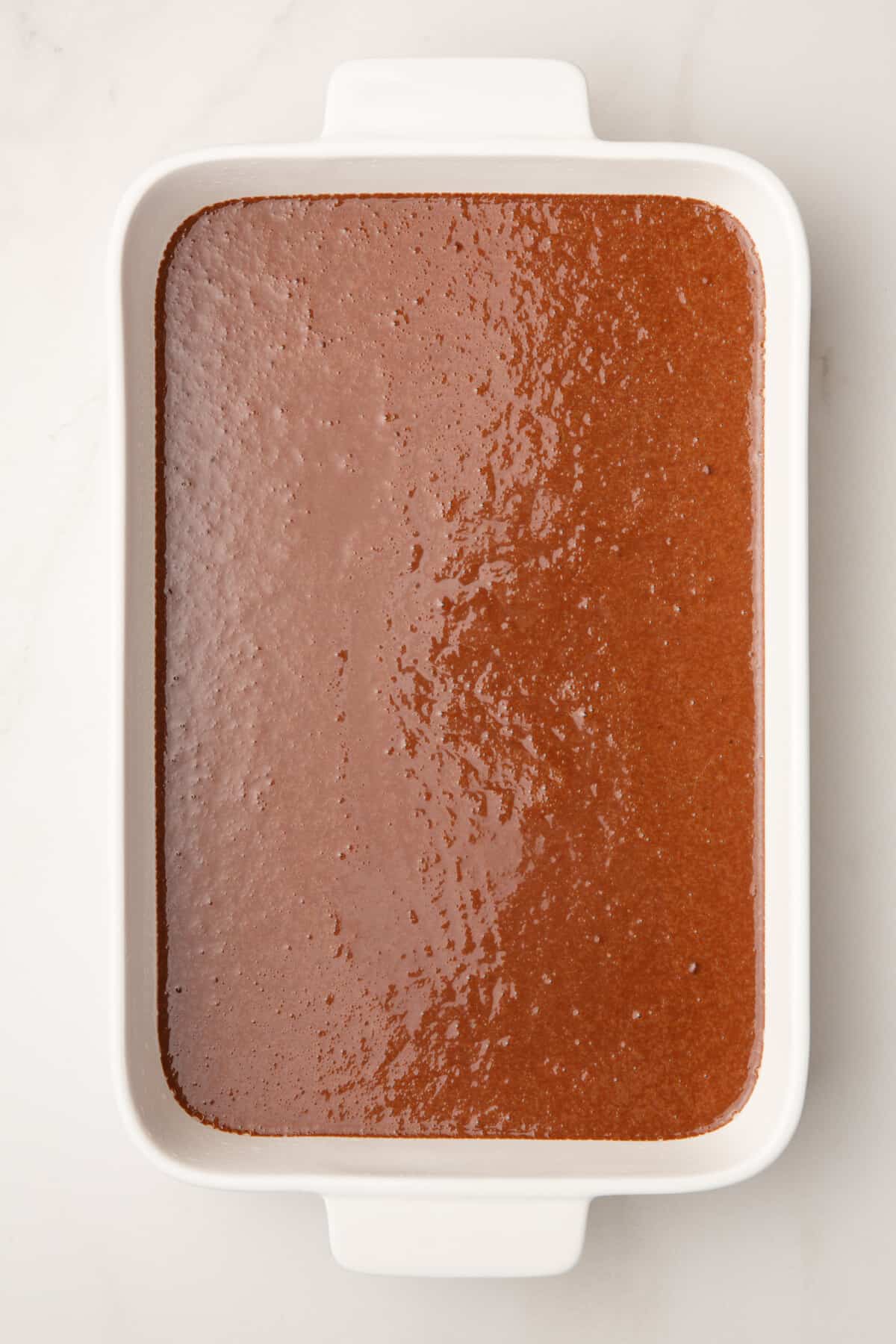 chocolate cake batter in a 9x13 casserole dish.