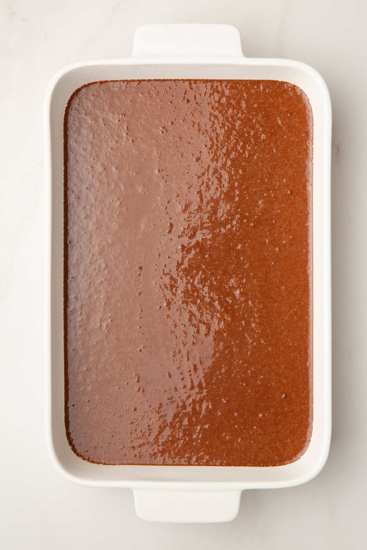 chocolate cake batter in a 9x13 casserole dish