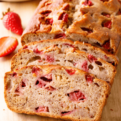 Strawberry banana bread with two slices cut.