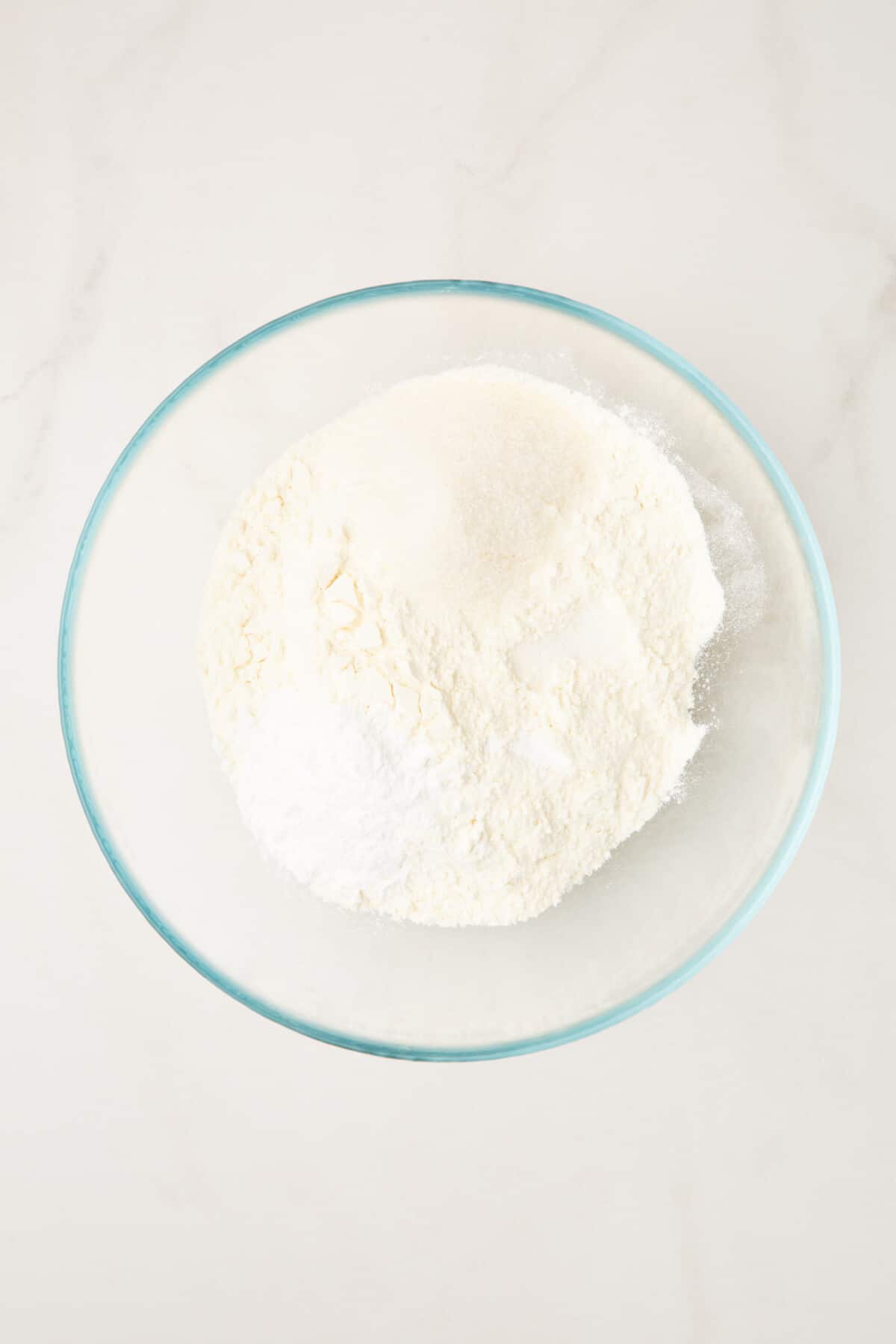 step 1 to make strawberry pancakes, combine dry ingredients in a large glass bowl.