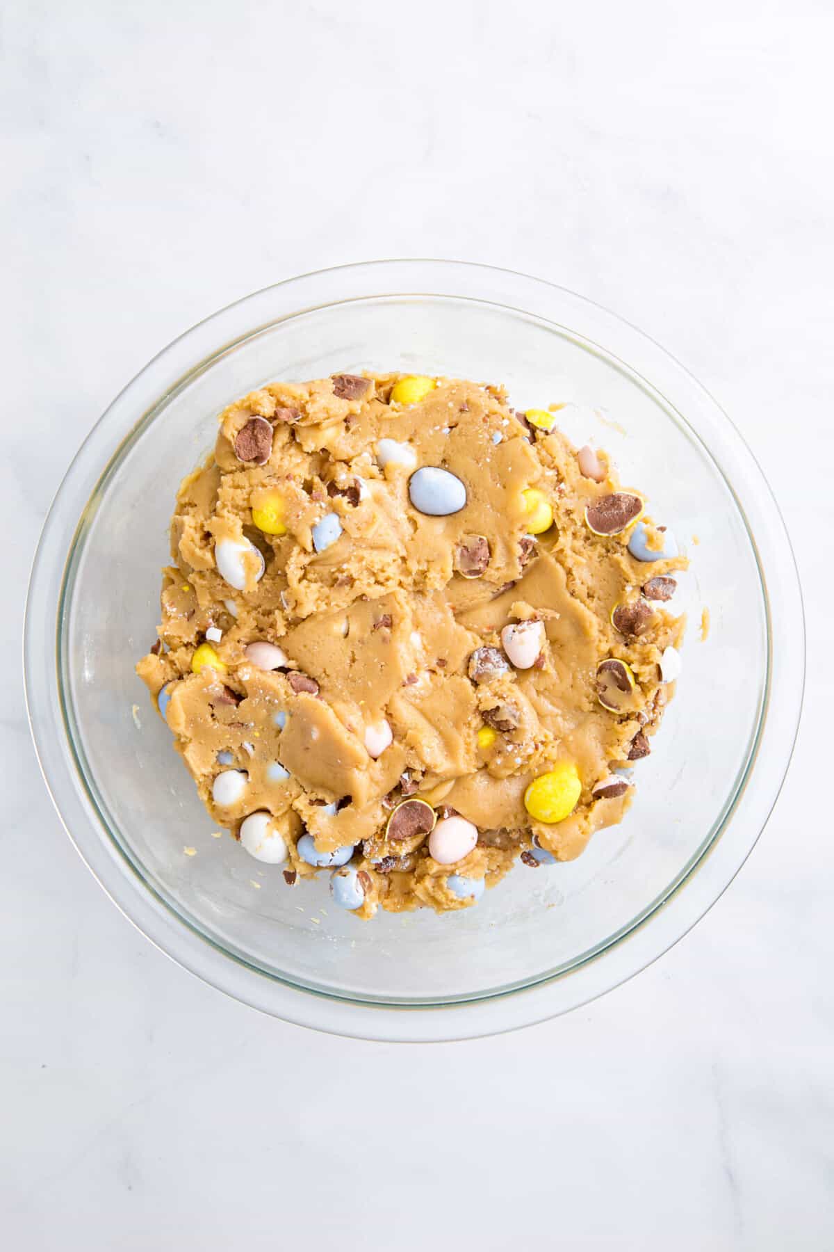 cadbury egg cookie dough in a large glass bowl.