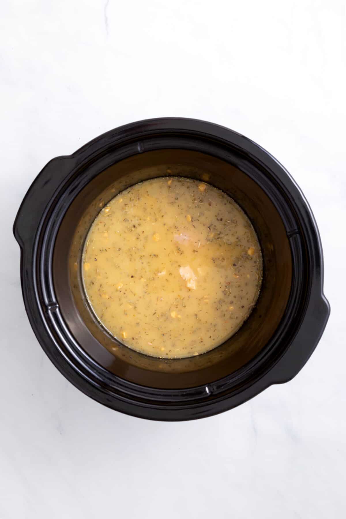 chicken stock in a crockpot.