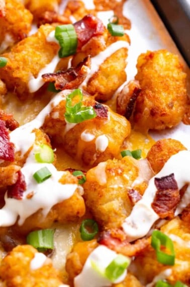 Loaded tater tots topped with bacon and Ranch.