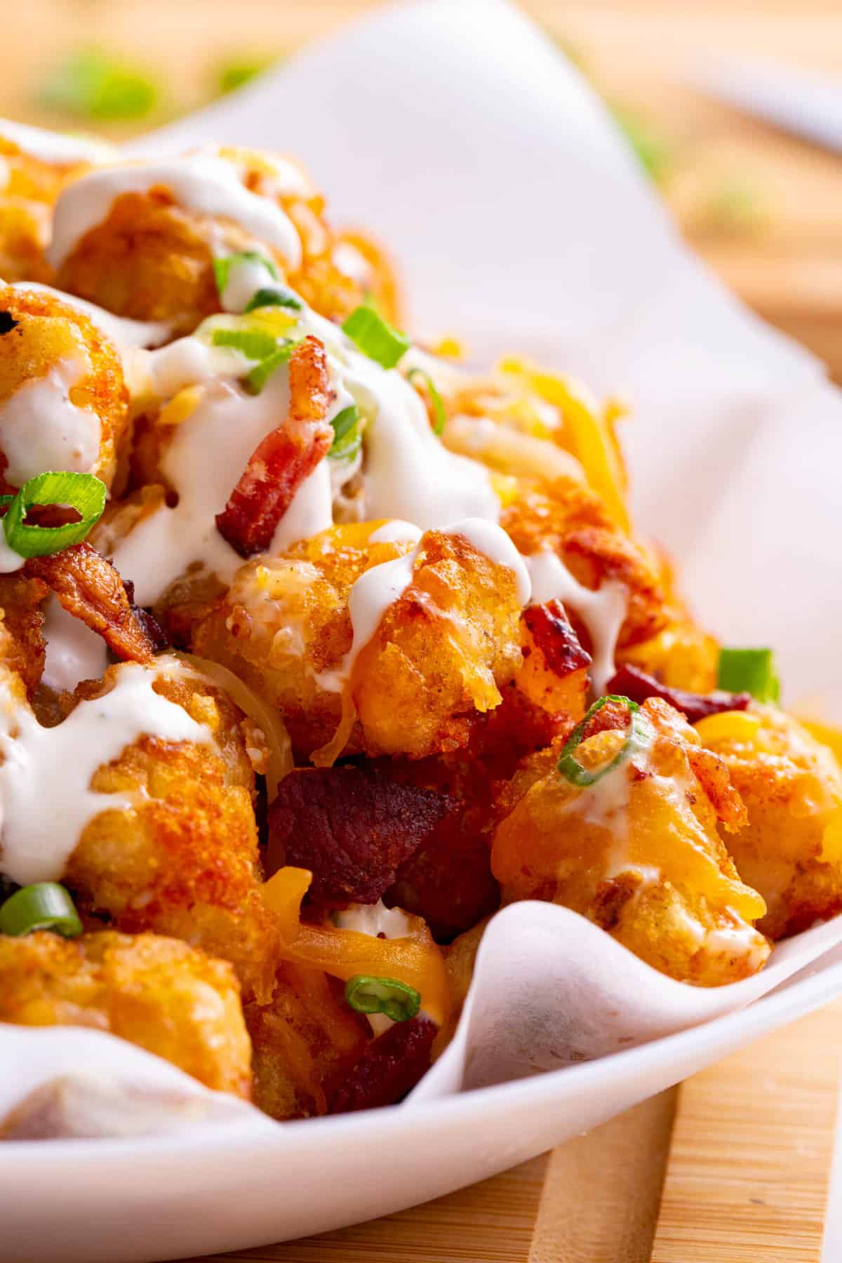 close up image of a bowl of loaded tater tots
