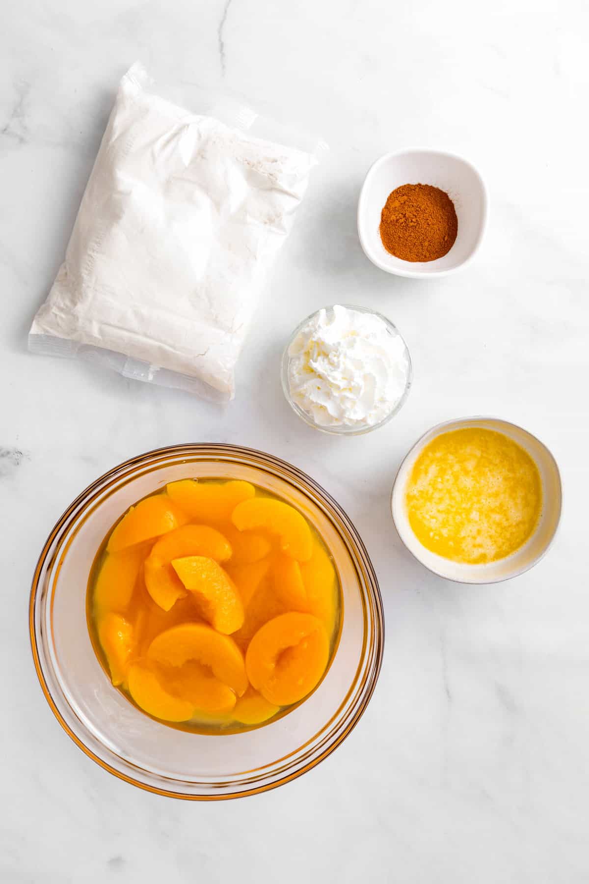 ingredients to make peach cobbler made with cake mix