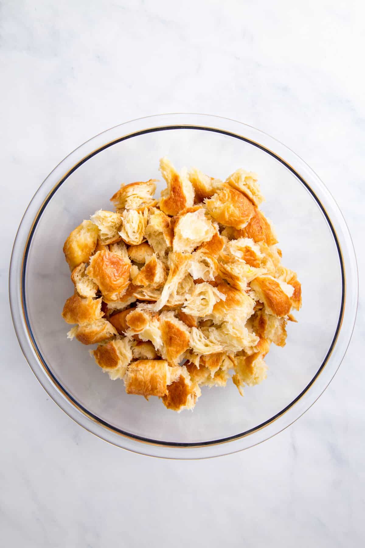 glass bowl fill of stale pieces of bread