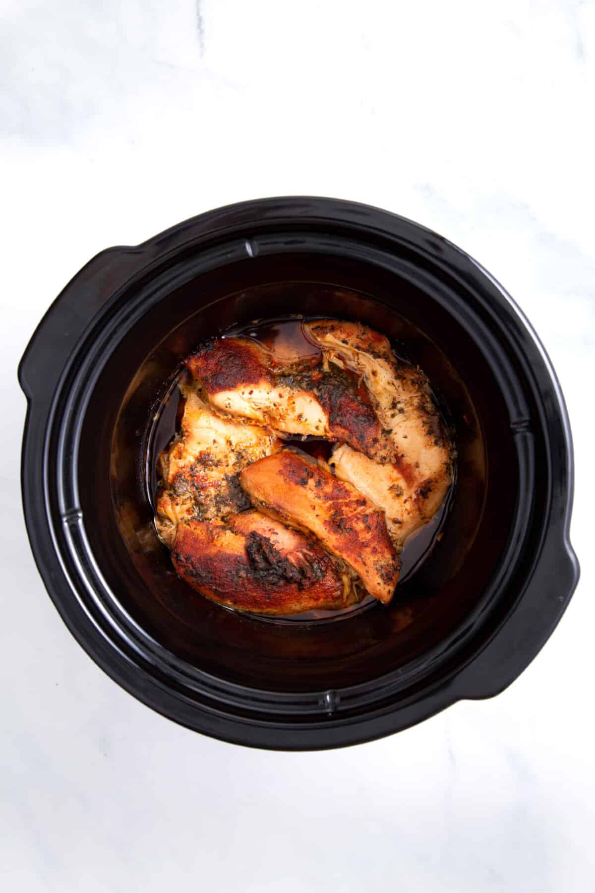 cooked chicken in a slow cooker.