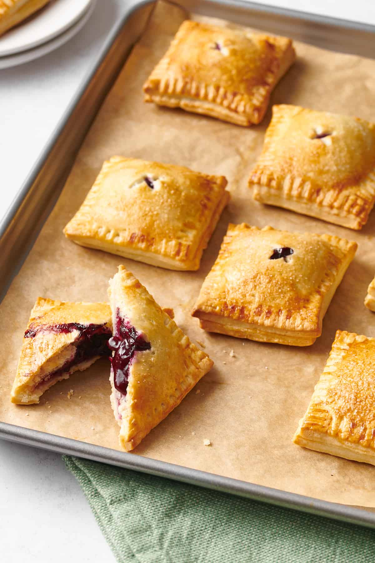 baking tray of blueberry hand pies