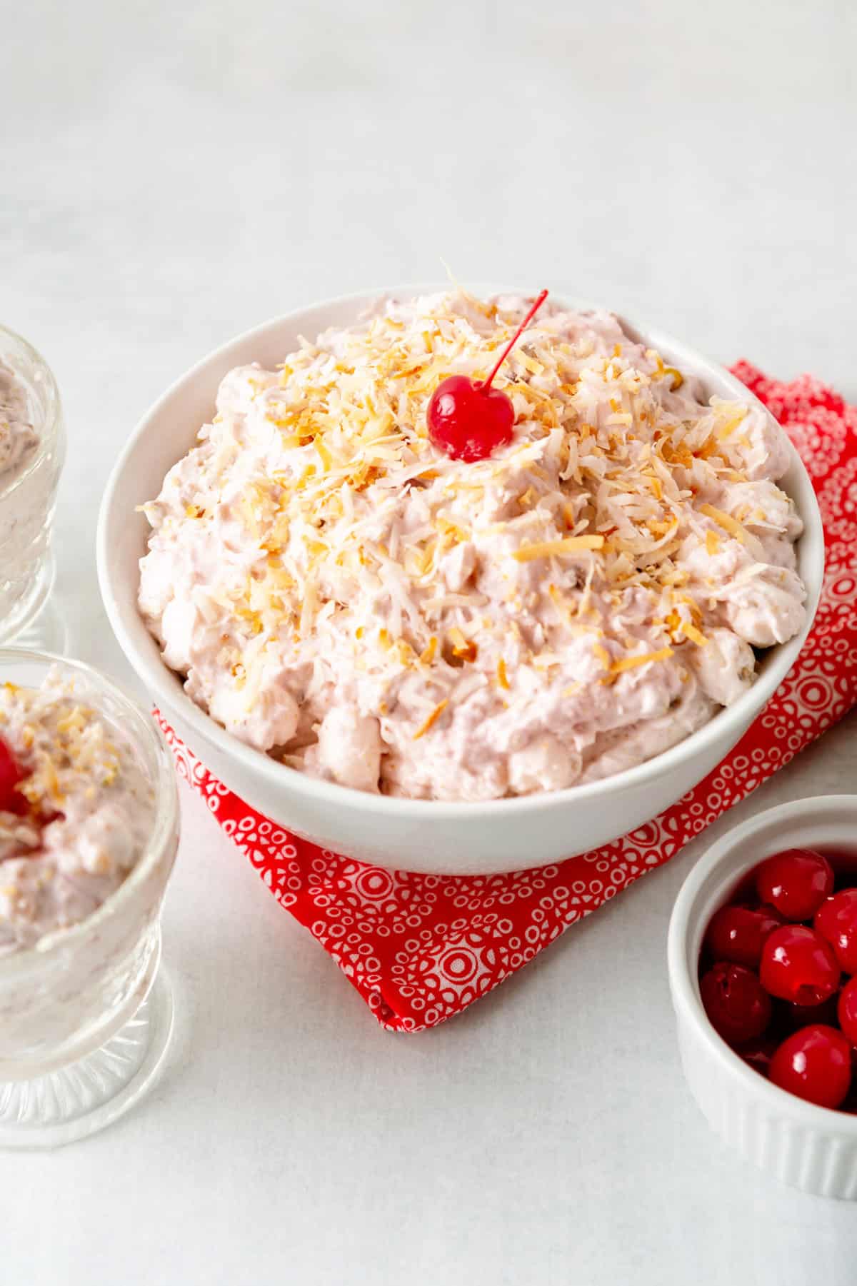 cherry fluff salad in a large white bowl