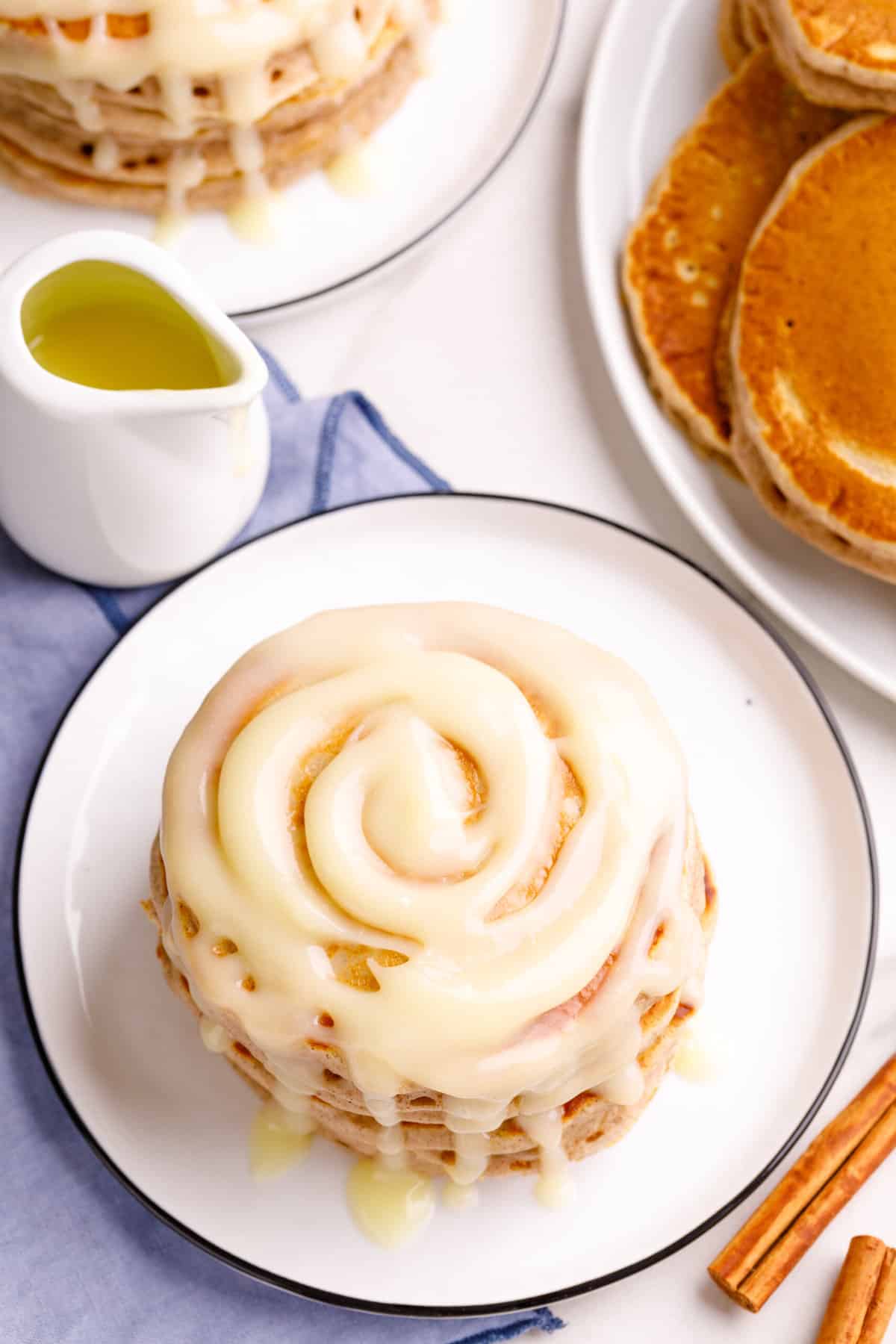 top down image of a plate of cinnamon pancakes with glaze