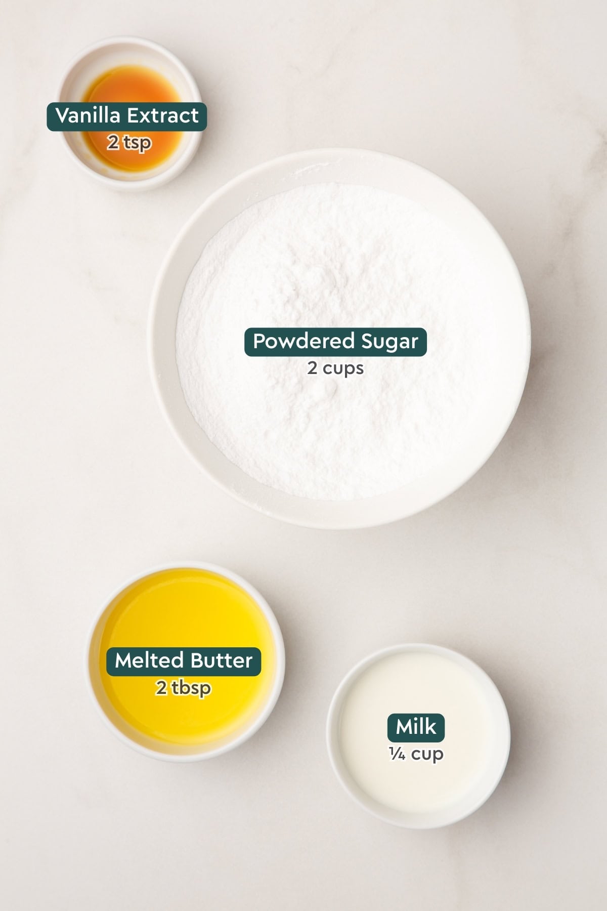 Ingredients for glaze, including vanilla, powdered sugar, butter, and milk.