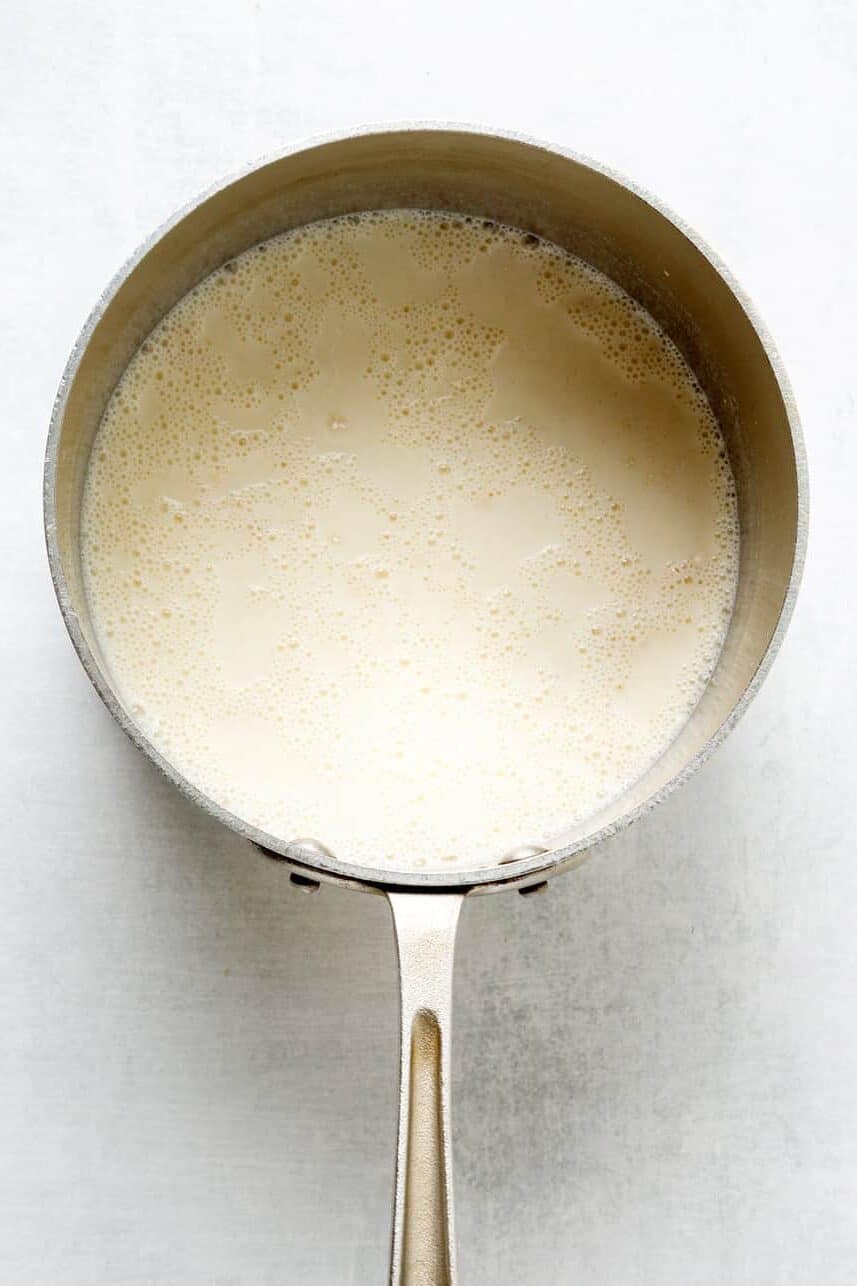 warmed milk mixture for banana pudding in a sauce pan