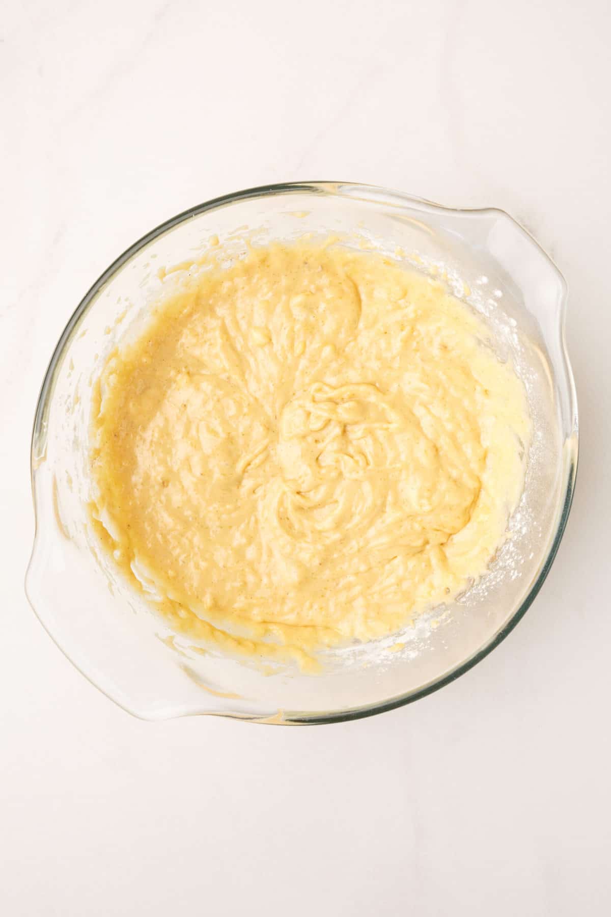 banana bread batter in a large glass bowl