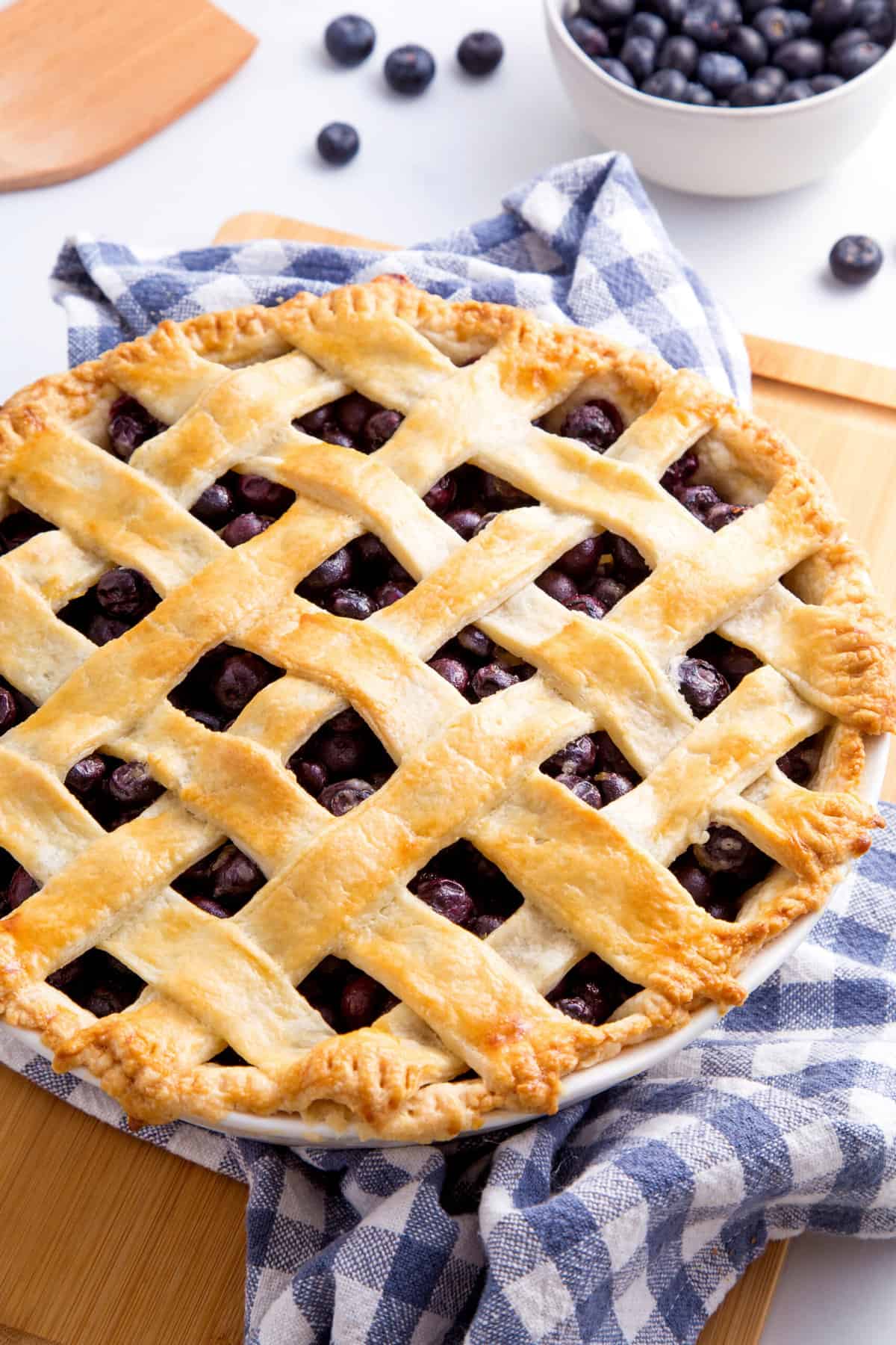 baked and golden blueberry pie with a lattice design