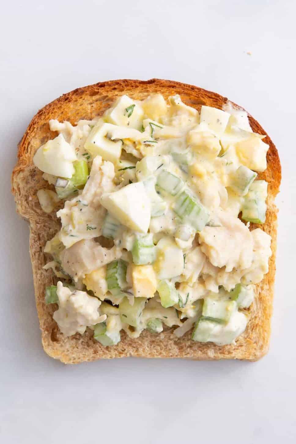 chick fil a chicken salad on a slice of toasted wheat bread