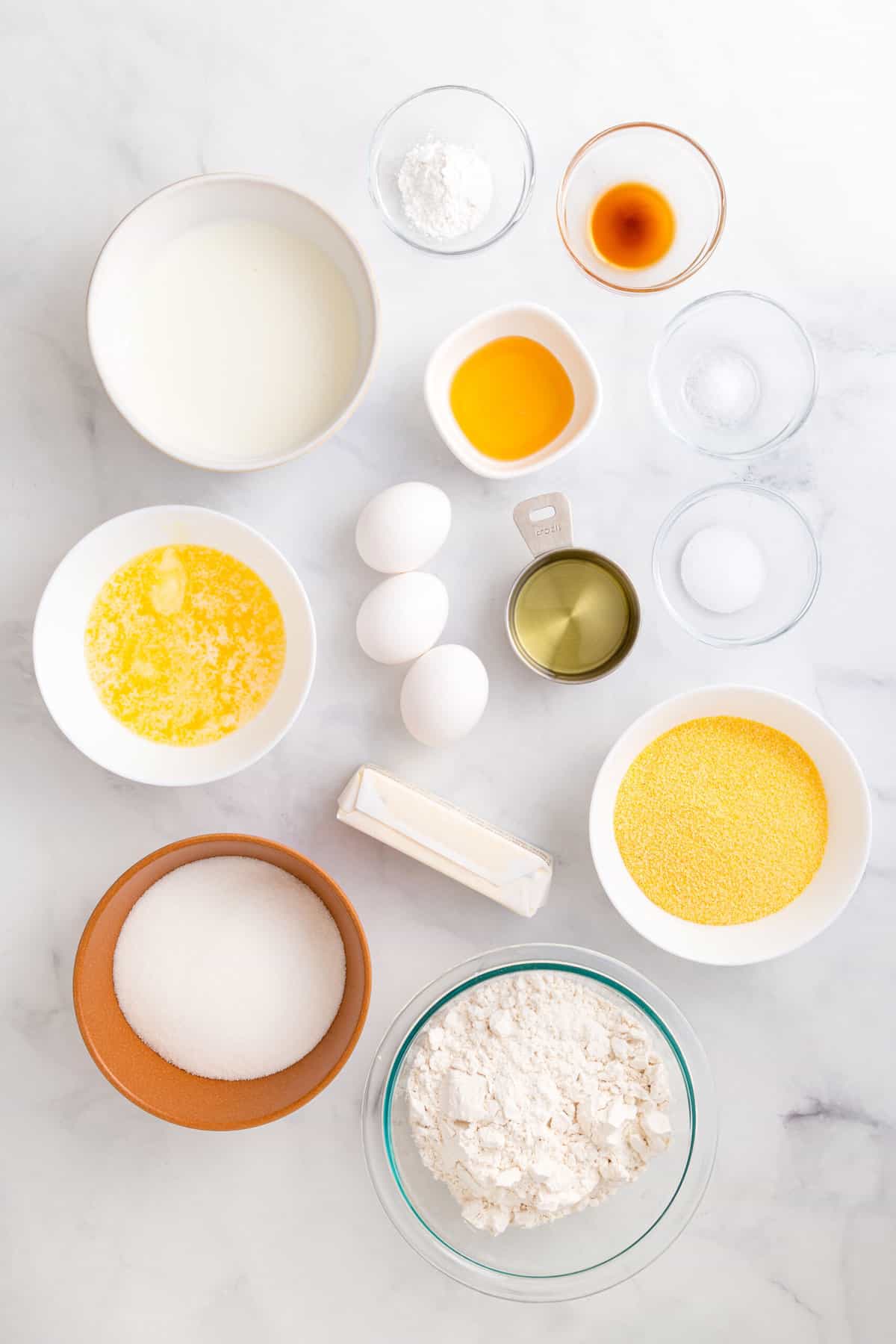 ingredients to make homemade corn muffins and honey butter