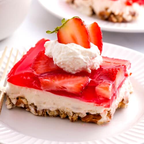 A square of strawberry pretzel salad on a plate.