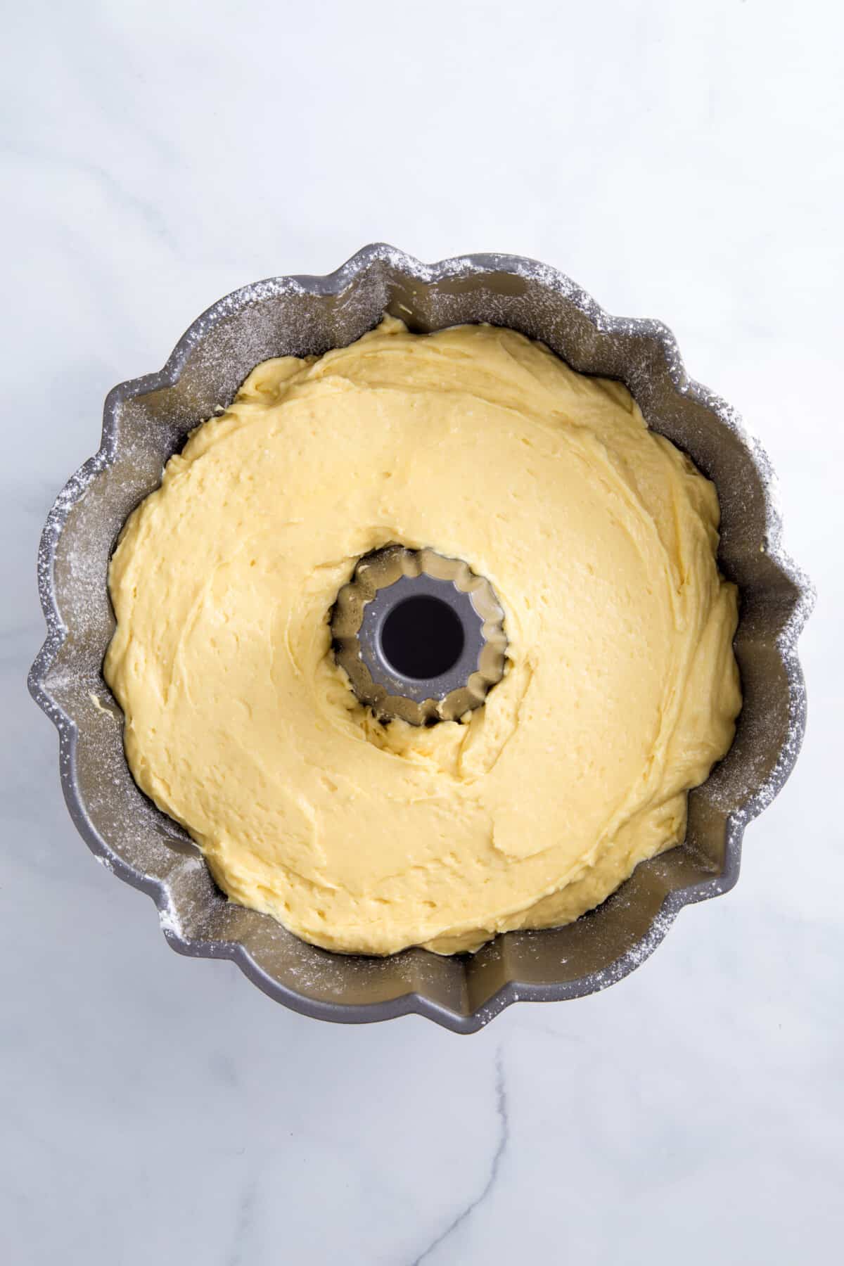 cake mix pound cake batter in a large bundt cake pan.