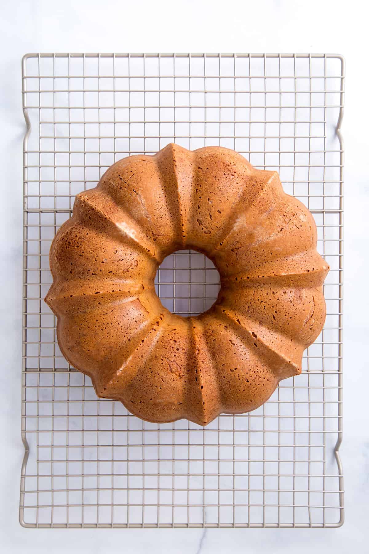 cake mix pound cake batter cooling on a wire rack.