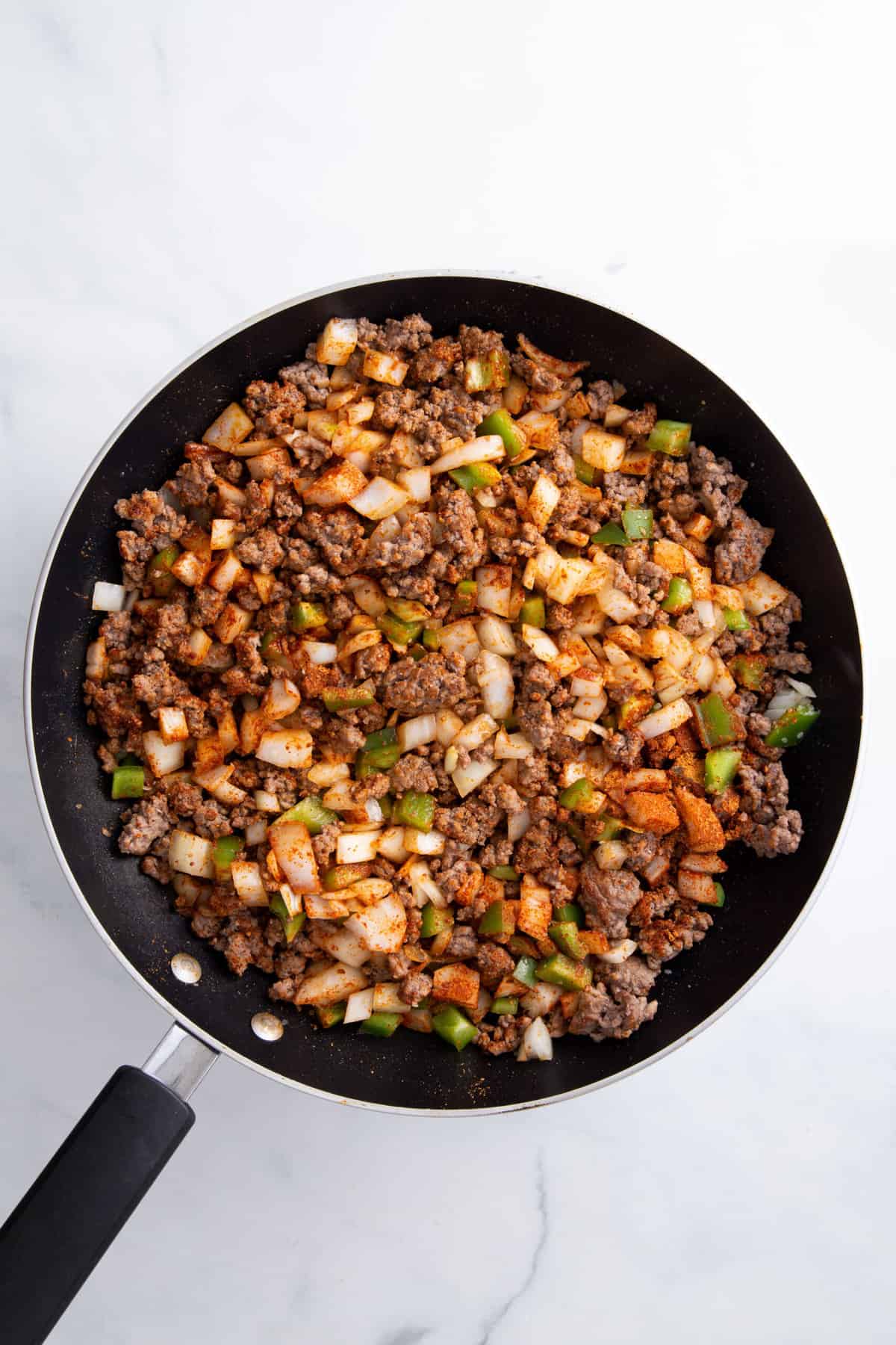 taco meat cooked with chopped veggies