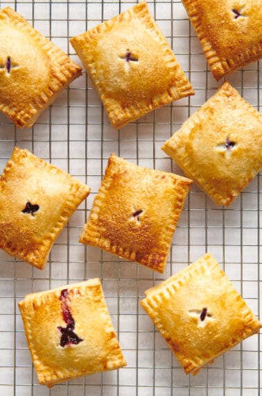 Blueberry hand pies on a wire rack.