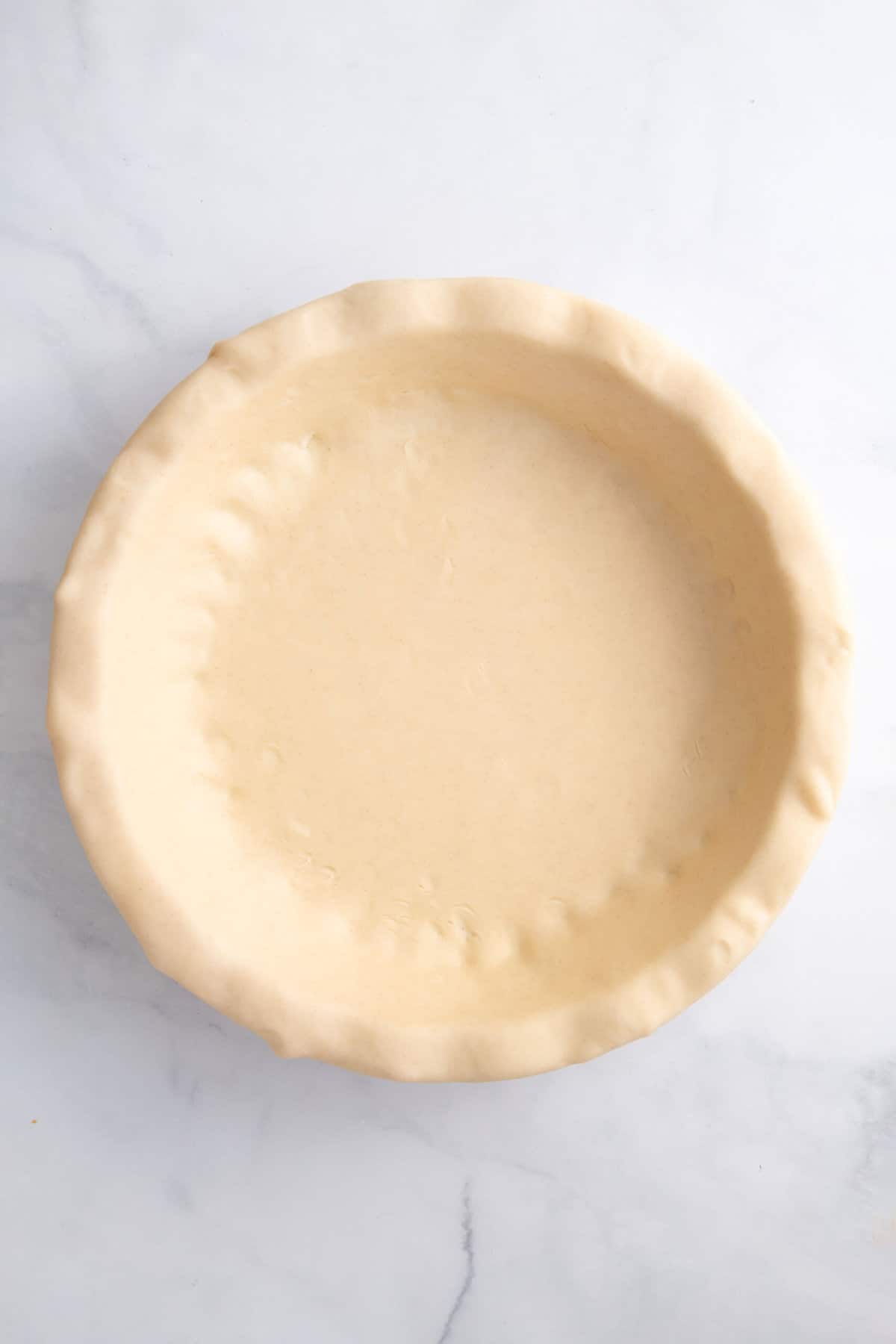 prepared pie crust in a pie dish