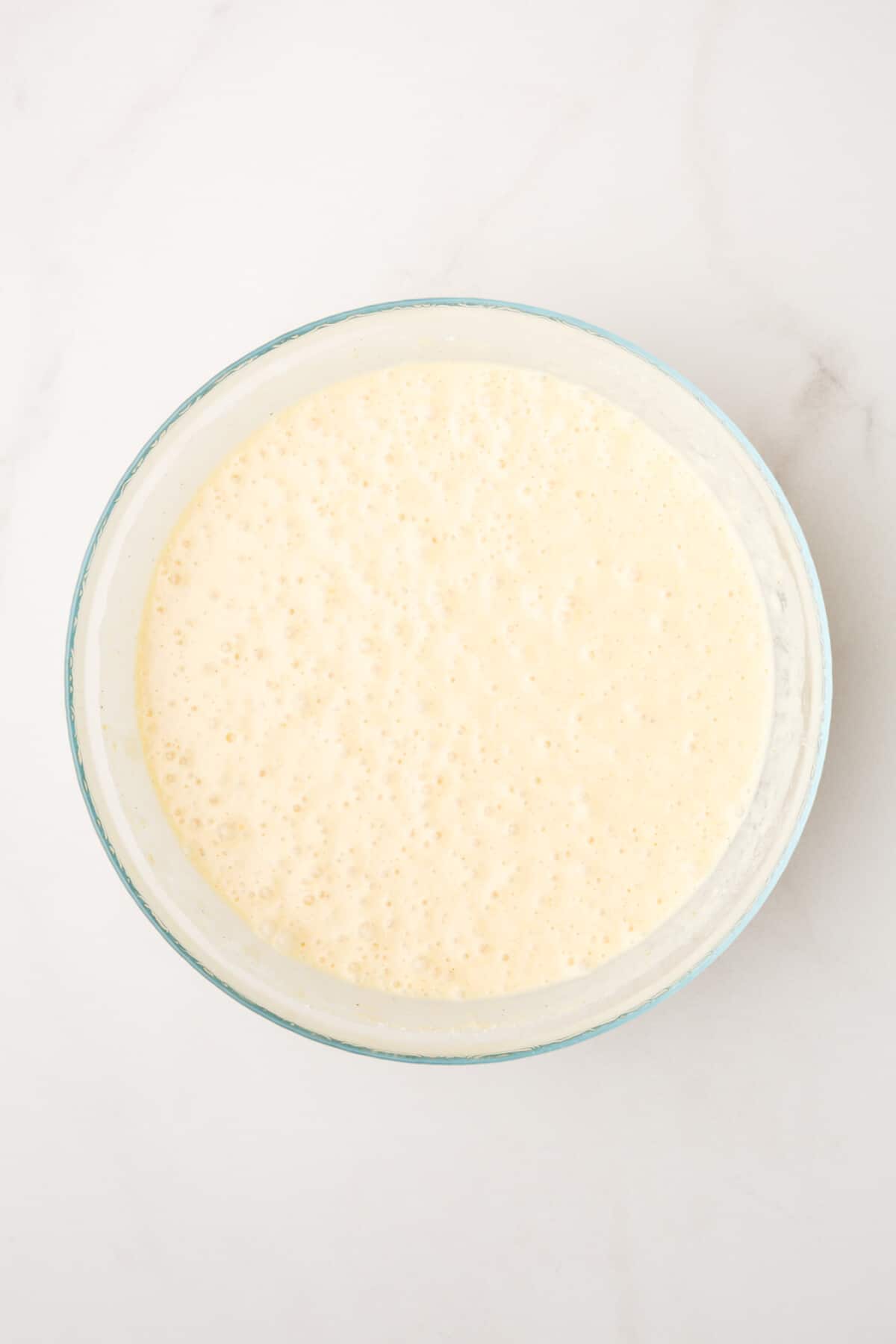 pancake batter in a large glass bowl.