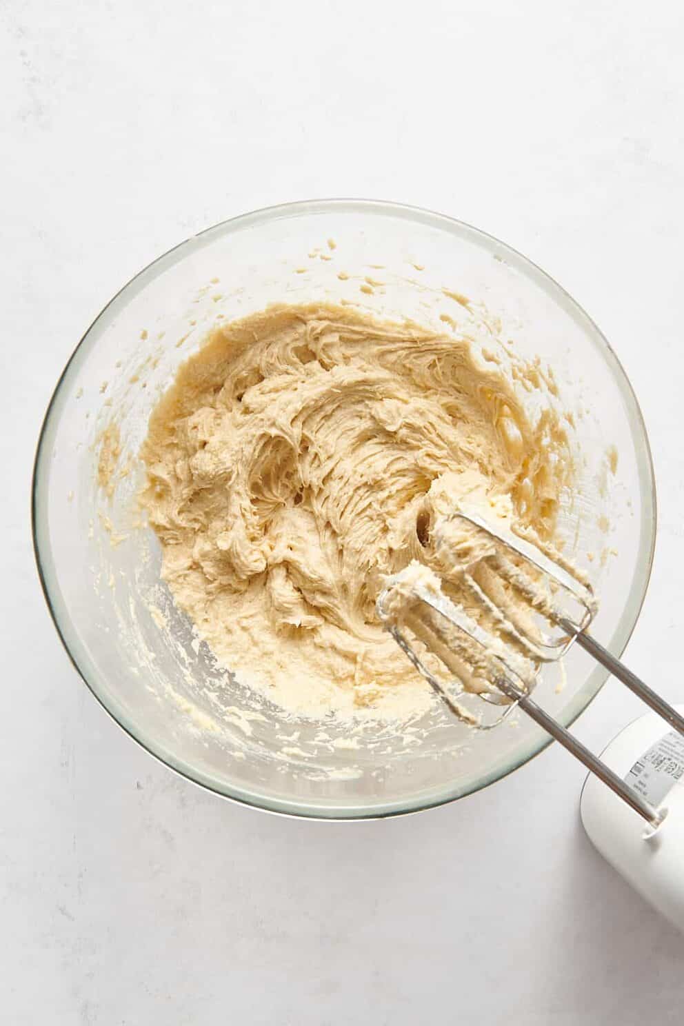 butter and sugar creamed with an electric whisk in a large glass bowl