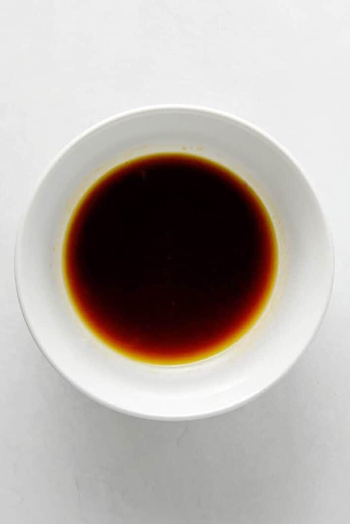 white bowl of soy sauce