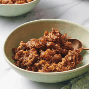 A bowl of slow cooker apple crisp.