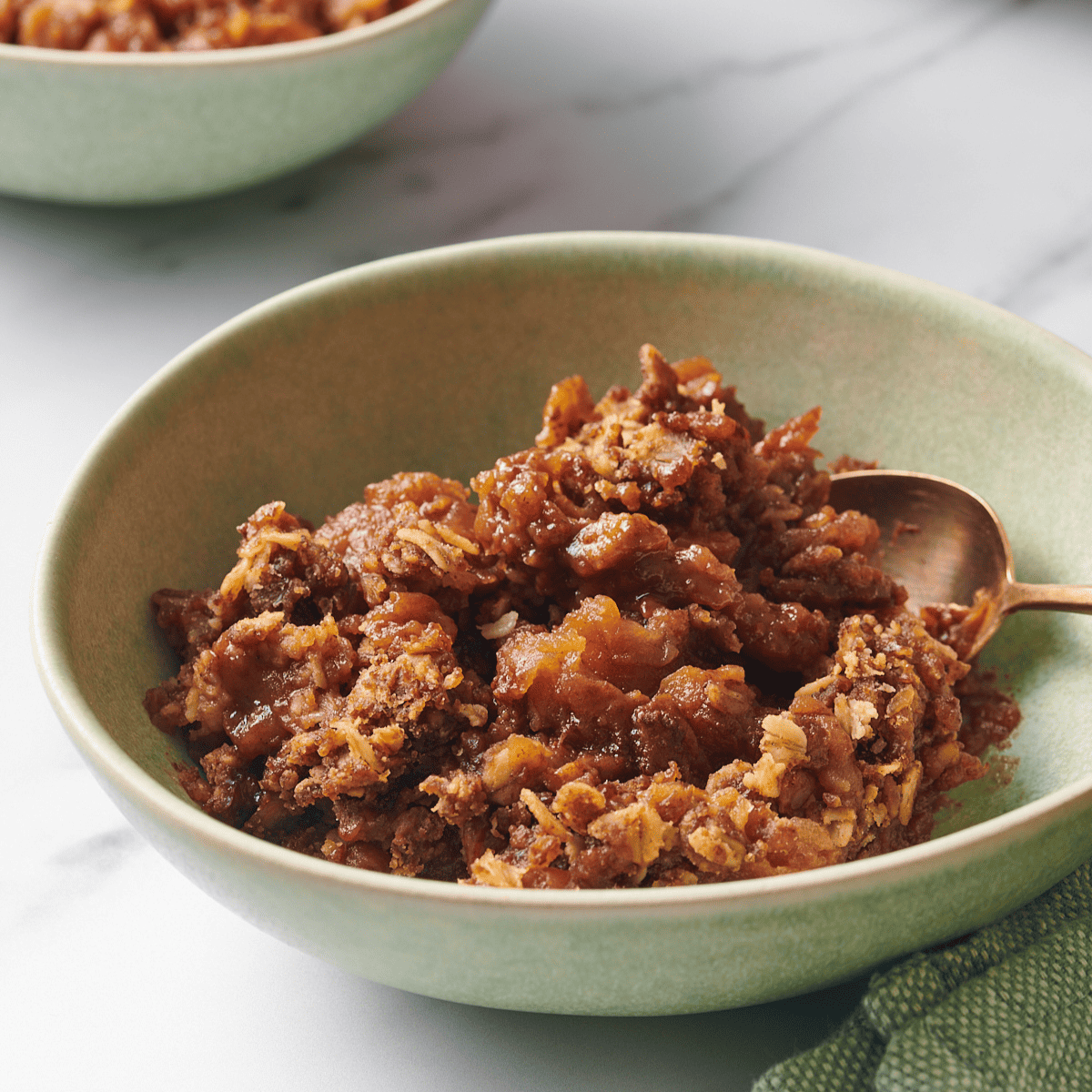 A bowl of slow cooker apple crisp.