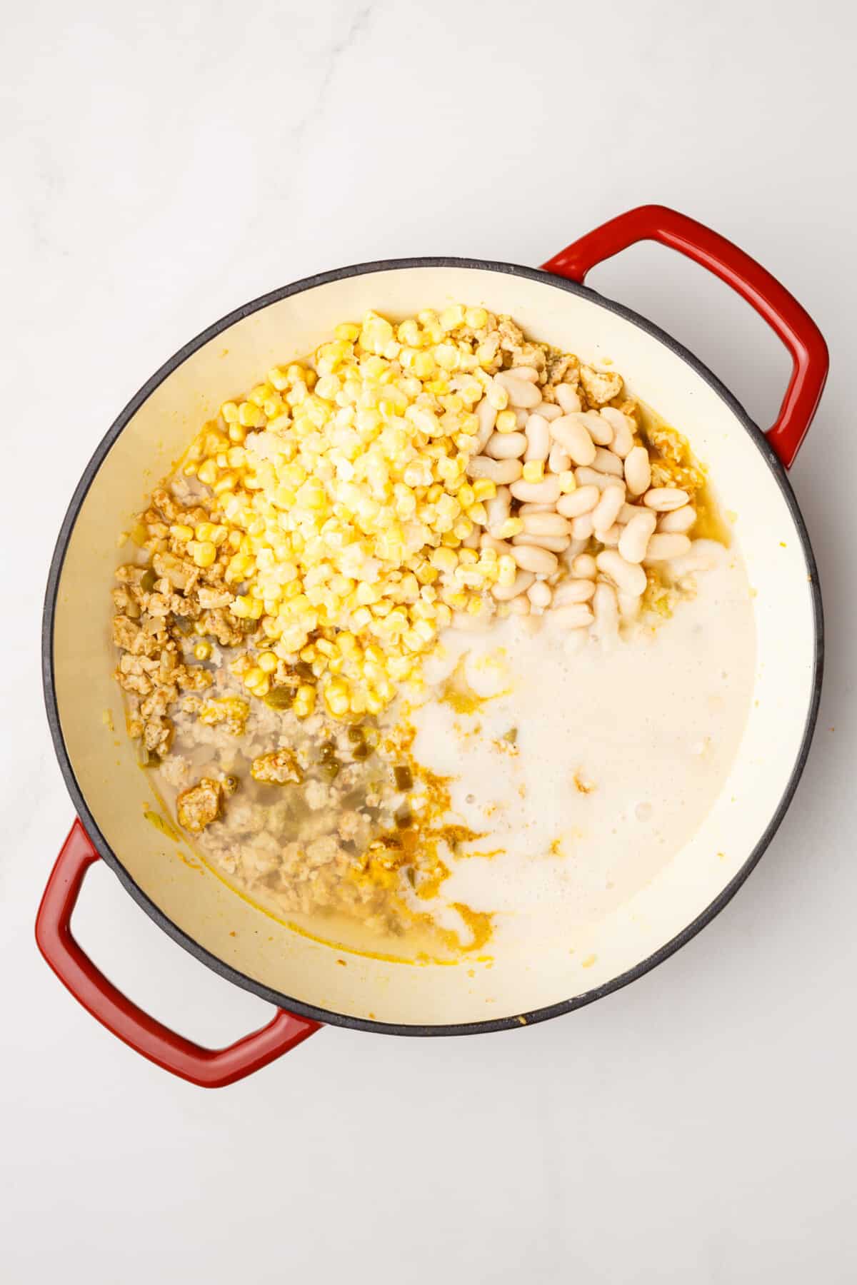 White beans, pureed beans, and corn added to pot for chicken chili.