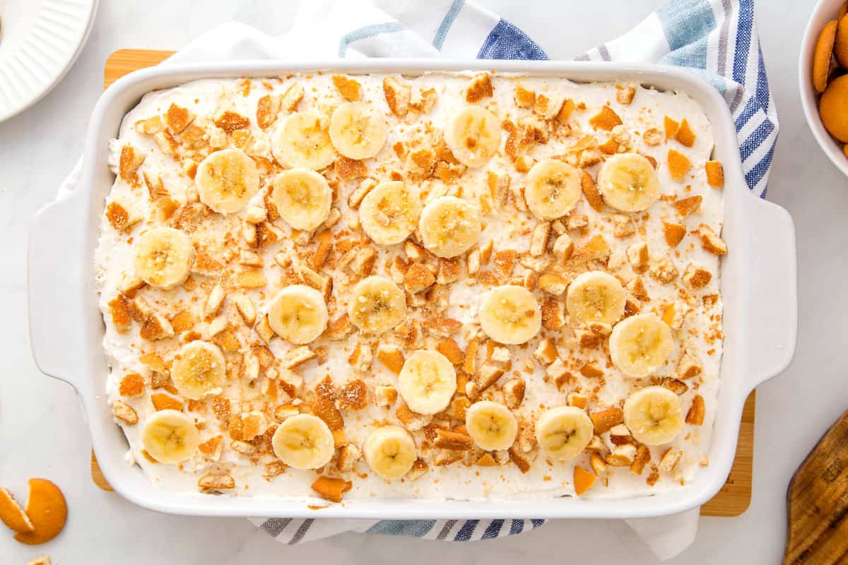 Overhead image of a baking dish of banana pudding poke cake.