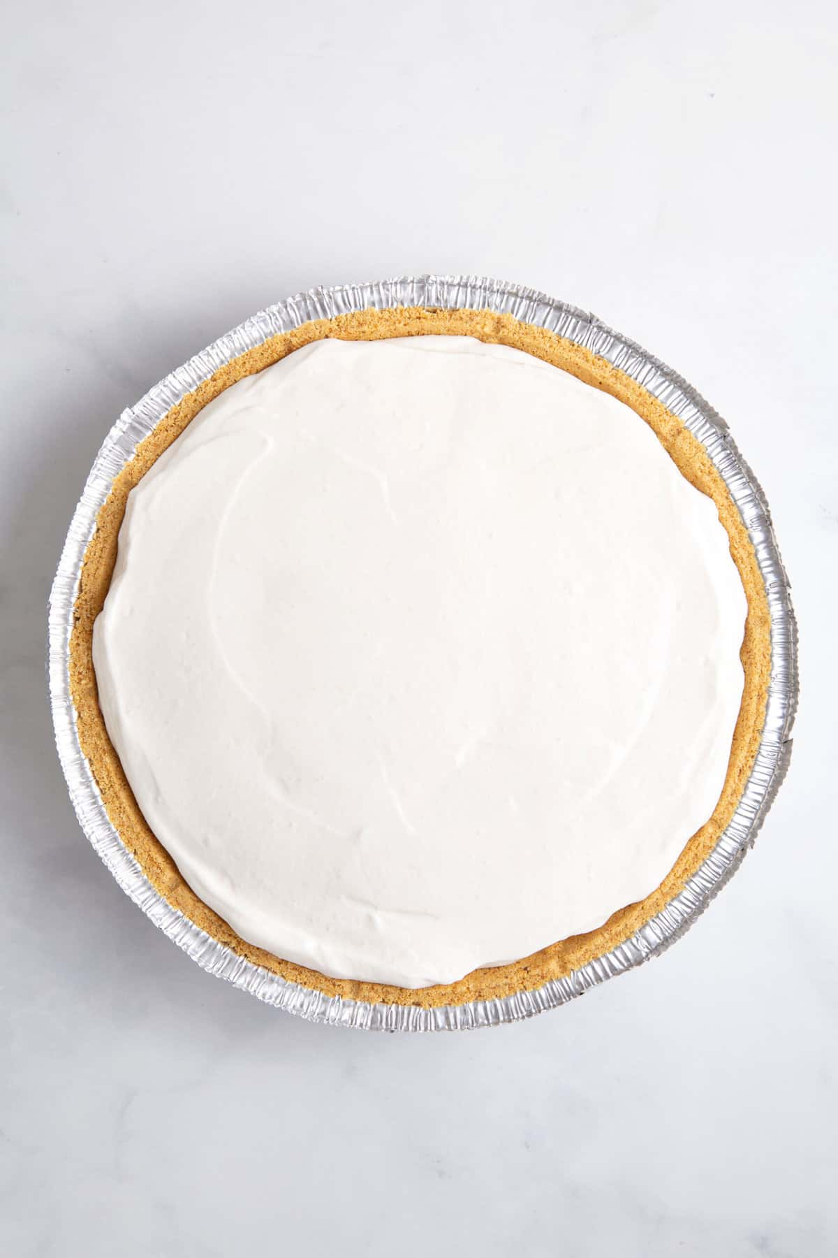 cool whip pie mixture prepared in a pie crust lined pan