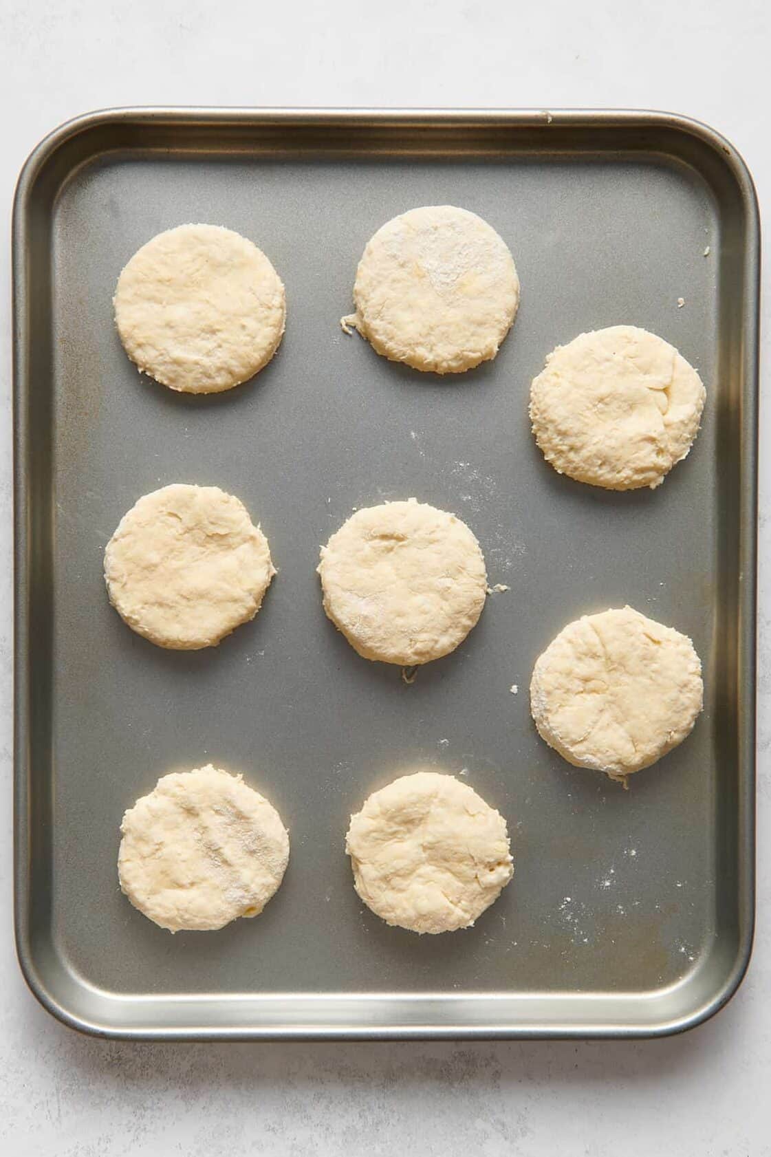 8 biscuits cut and arranged on a baking tray