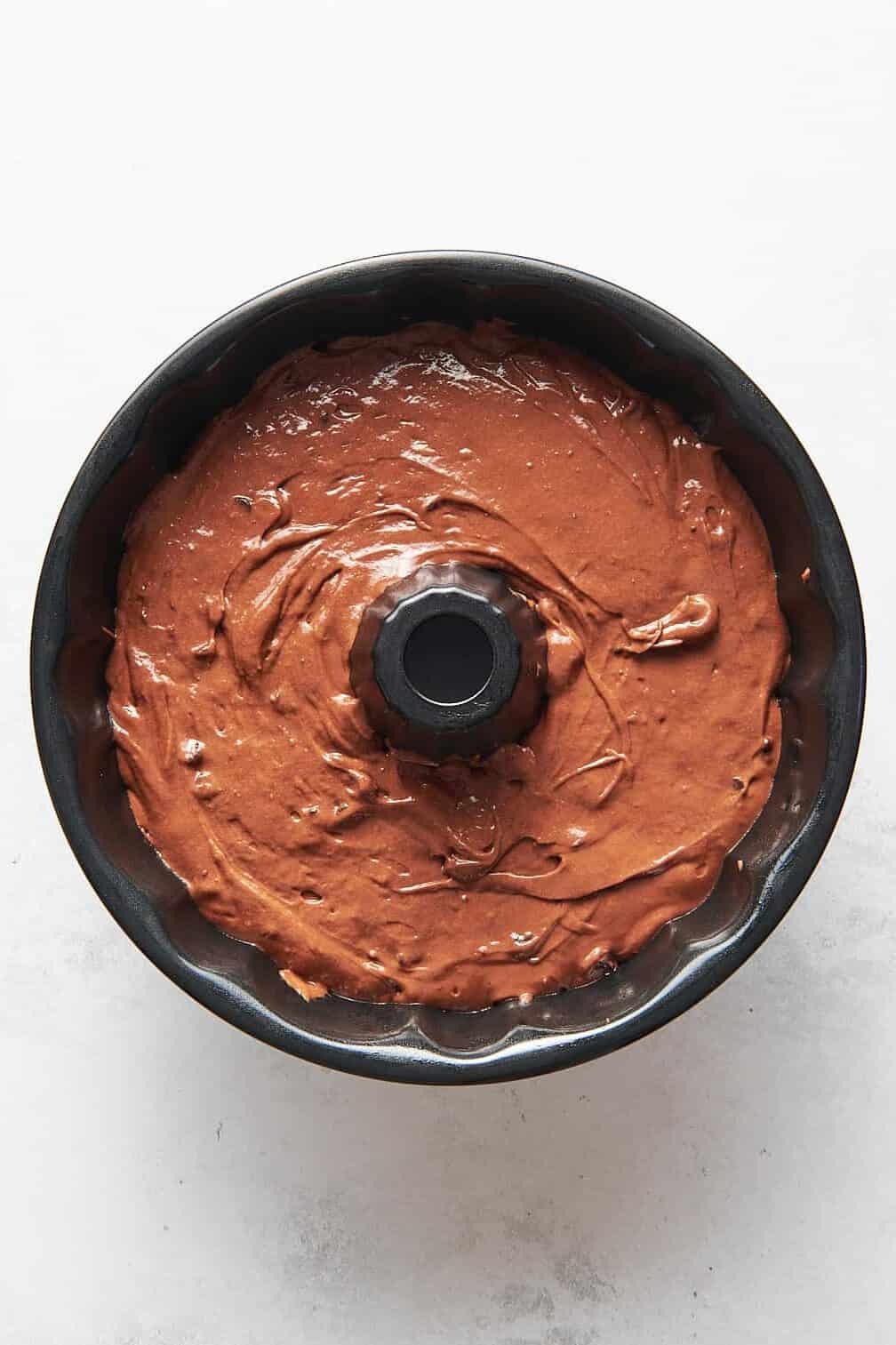 chocolate kahlua cake batter sitting in a bundt cake pan