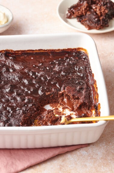 chocolate pudding cake with a serving missing.