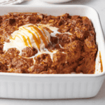Pumpkin bread pudding topped with vanilla ice cream and caramel sauce.