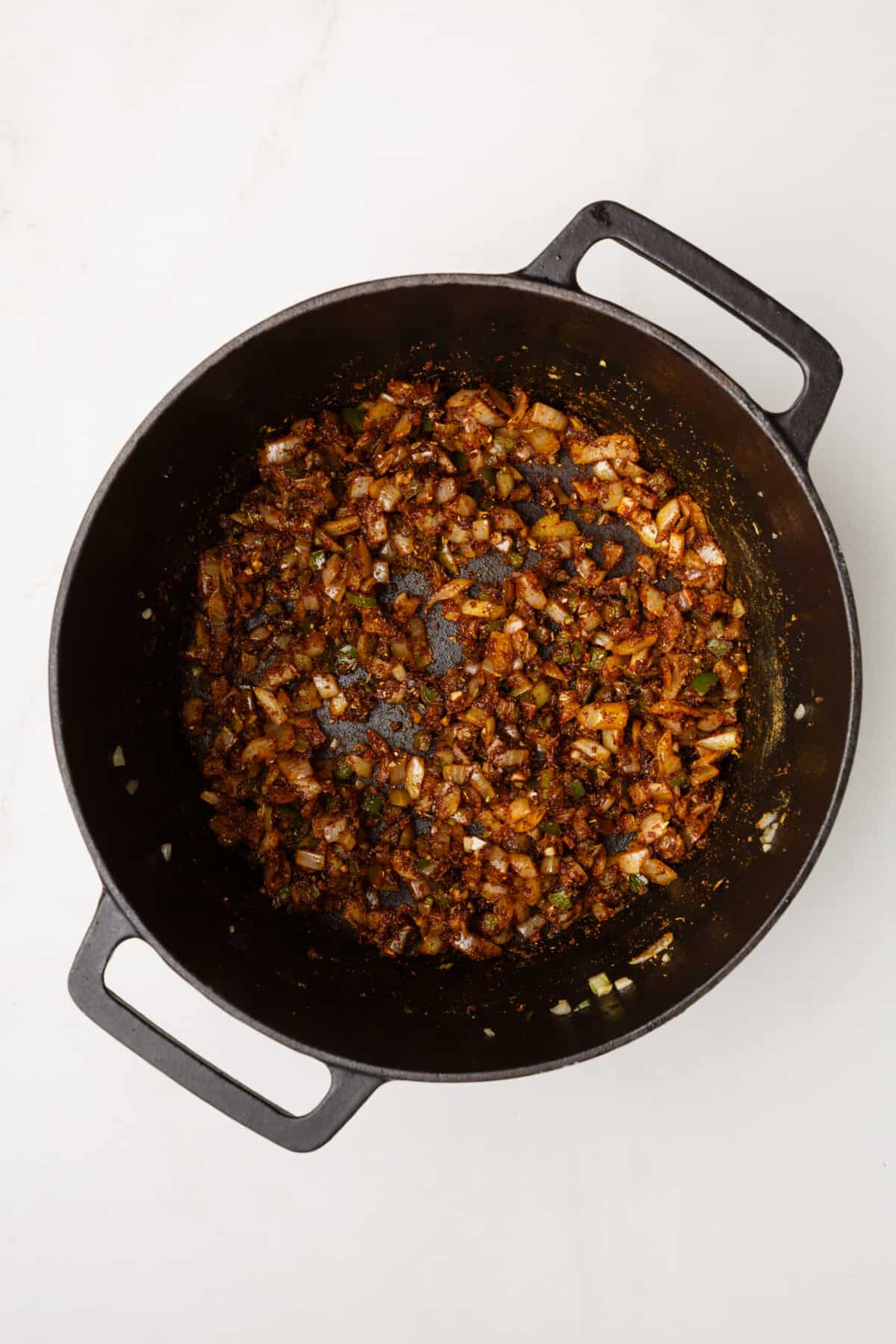 dutch oven with sauteed onion, garlic and jalapenos