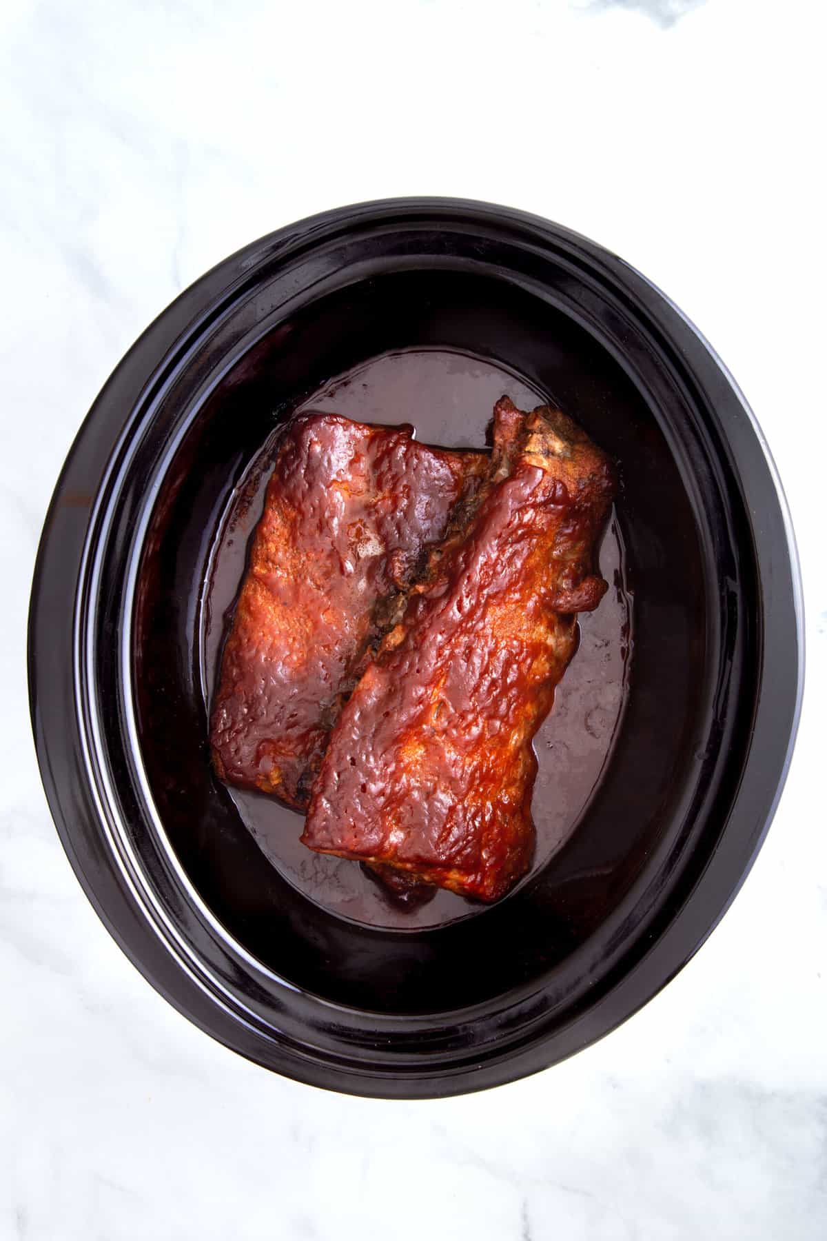 cooked ribs in a slow cooker