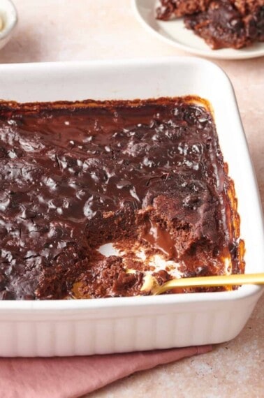 chocolate pudding cake with a serving missing.