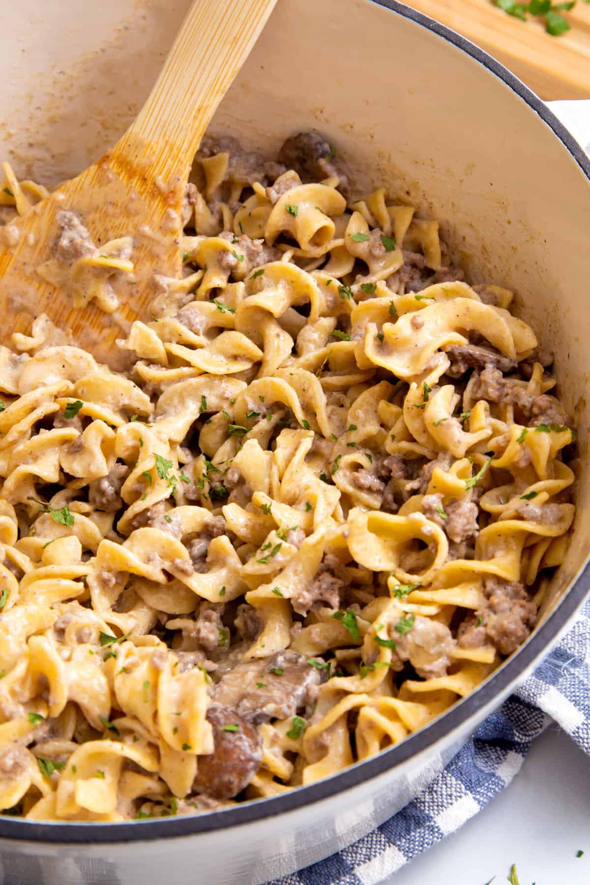 close up image of ground beef stroganoff in a dutch oven