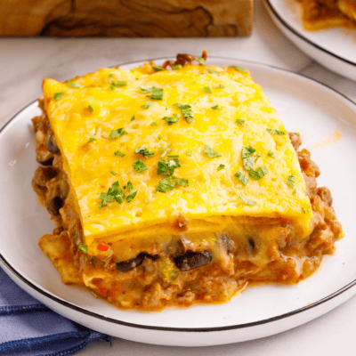 A portion of taco lasagna on a plate.